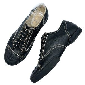 CHANEL Black and Cream Sneakers